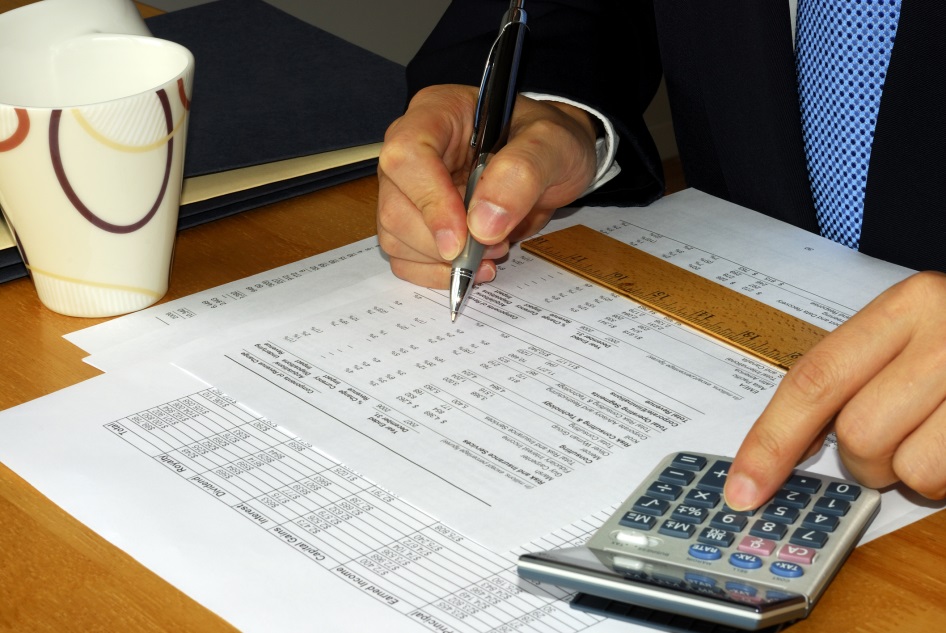 An Accountant Working Through Lines in a Budget