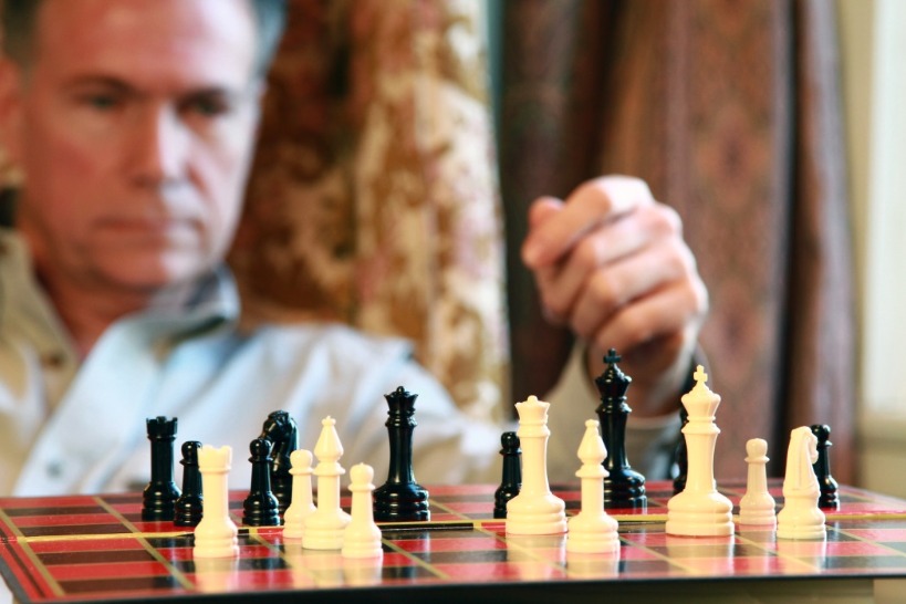 A Man Playing Chess