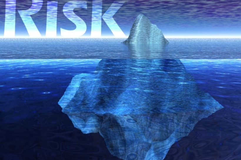 An Iceberg in a Body of Water with the Word "Risk"